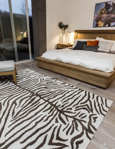 Light rustic wood floor animal print rug | Nielson Fine Floors | Lincoln, CA